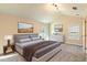 Comfortable bedroom with neutral color scheme, plush carpeting, and abundant natural light from the windows at 204 Elm St, Palmetto, GA 30268