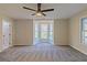 Bright bedroom featuring a bay window, neutral carpet, and ample natural light at 204 Elm St, Palmetto, GA 30268