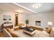 Stylish living room with hardwood floors, brick fireplace, neutral-toned furniture, and abundant natural light at 204 Elm St, Palmetto, GA 30268