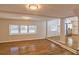 Spacious living room with hardwood flooring, natural light, and an open layout flowing into the kitchen at 204 Elm St, Palmetto, GA 30268