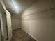 Spacious walk-in closet featuring neutral carpeting and ample shelving for optimal organization at 35 Yellow Brick Way, Covington, GA 30014