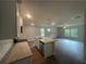 Modern kitchen featuring granite countertops, stainless steel appliances, and a breakfast bar area at 35 Yellow Brick Way, Covington, GA 30014