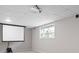 Finished basement media room with projector and screen at 6275 Cheatham Lake Nw Dr, Acworth, GA 30101