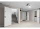 Finished basement with stairs, projector, and recessed lighting at 6275 Cheatham Lake Nw Dr, Acworth, GA 30101