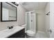 Well-lit bathroom featuring a shower, vanity with sink, and neutral wall color at 6275 Cheatham Lake Nw Dr, Acworth, GA 30101