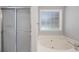 Shower with glass door and soaking tub at 6275 Cheatham Lake Nw Dr, Acworth, GA 30101
