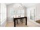 Bright dining area with shuttered windows and access to outdoor patio at 6275 Cheatham Lake Nw Dr, Acworth, GA 30101