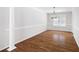 Dining room with hardwood floors, decorative lighting, and a large window at 6275 Cheatham Lake Nw Dr, Acworth, GA 30101