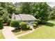 Charming single-story home featuring a inviting front porch, lush landscaping and a driveway at 6275 Cheatham Lake Nw Dr, Acworth, GA 30101
