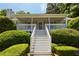 Eye-level view of home's front porch with white stairs, columns and trim at 6275 Cheatham Lake Nw Dr, Acworth, GA 30101