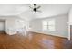 Spacious living room featuring high ceilings, wood floors, ceiling fan, and many windows at 6275 Cheatham Lake Nw Dr, Acworth, GA 30101