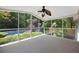 Enclosed porch overlooking pool and lush backyard at 6275 Cheatham Lake Nw Dr, Acworth, GA 30101