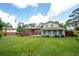 Spacious backyard view, highlighting the large yard, deck, and mature trees at 4205 Jeri Lynn Ct, Tucker, GA 30084