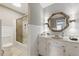 Elegant bathroom with a bathtub, decorative mirror, and stylish vanity offers a relaxing atmosphere at 4205 Jeri Lynn Ct, Tucker, GA 30084