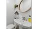 Small bathroom with white walls, a unique mirror, and modern fixtures at 4205 Jeri Lynn Ct, Tucker, GA 30084