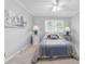Cozy bedroom with carpet flooring, a ceiling fan, and lots of natural light offers a comfortable space at 4205 Jeri Lynn Ct, Tucker, GA 30084