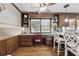 Cozy breakfast nook/desk area featuring custom wooden cabinets and a serene view at 4205 Jeri Lynn Ct, Tucker, GA 30084