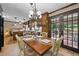 Open floor plan dining area leading to deck with dark wood cabinets at 4205 Jeri Lynn Ct, Tucker, GA 30084