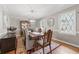 Formal dining room with elegant decor, hardwood floors, and a chandelier for memorable gatherings at 4205 Jeri Lynn Ct, Tucker, GA 30084