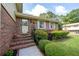 Home featuring a brick facade, complemented by lush landscaping and an inviting front entry at 4205 Jeri Lynn Ct, Tucker, GA 30084
