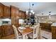 Kitchen with dark wood cabinets, stainless steel appliances, and dining nook at 4205 Jeri Lynn Ct, Tucker, GA 30084