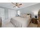 Bright main bedroom with a ceiling fan, carpet floors, and closet for storage, offering a cozy retreat at 4205 Jeri Lynn Ct, Tucker, GA 30084