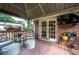 Covered patio with comfortable seating, a television, and a view of the backyard at 4205 Jeri Lynn Ct, Tucker, GA 30084