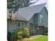 View of home showing two-story architectural details, basketball hoop, well-maintained landscaping, and clean exterior at 4287 Ridgetop Trl, Ellenwood, GA 30294