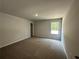 Bedroom with carpet, one window, and closet at 142 Tye St, Stockbridge, GA 30281