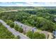 Aerial view showcasing community homes surrounded by lush greenery at 1744 Habershal Nw Dr, Atlanta, GA 30318