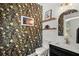 Half bathroom featuring modern wallpaper, shiplap, and floating shelves at 1744 Habershal Nw Dr, Atlanta, GA 30318
