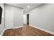 An empty bedroom features hardwood flooring, white trim, and neutral paint at 1744 Habershal Nw Dr, Atlanta, GA 30318