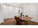 Elegant dining room with modern wood paneled walls and stylish light fixture at 1744 Habershal Nw Dr, Atlanta, GA 30318
