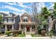 Charming two-story townhome with inviting front porch and well-maintained landscaping at 1744 Habershal Nw Dr, Atlanta, GA 30318