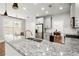 Modern kitchen with granite countertops, stainless steel appliances, and stylish fixtures at 1744 Habershal Nw Dr, Atlanta, GA 30318