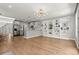 Spacious living room with an open layout, built-in shelves, and a modern kitchen at 1744 Habershal Nw Dr, Atlanta, GA 30318