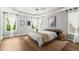 Serene main bedroom with tray ceiling, natural light, and neutral tones at 1744 Habershal Nw Dr, Atlanta, GA 30318