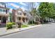 Street view of attractive townhomes with well-manicured lawns and sidewalks at 1744 Habershal Nw Dr, Atlanta, GA 30318
