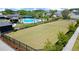 Aerial shot of a large manicured community lawn and pool with shaded pavilions at 1744 Habershal Nw Rd, Atlanta, GA 30318