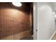 Unfinished basement featuring brickwork and a door frame at 1744 Habershal Nw Rd, Atlanta, GA 30318