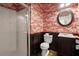 Unique bathroom with flamingo wallpaper, a shower and a sink with dark wood and white countertop at 1744 Habershal Nw Rd, Atlanta, GA 30318