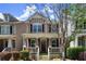 A well-maintained home with a cozy front porch, shutters and neatly trimmed bushes in a suburban neighborhood at 1744 Habershal Nw Rd, Atlanta, GA 30318