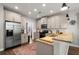 Bright kitchen showcasing stainless steel appliances, granite countertops, and a breakfast bar at 1744 Habershal Nw Rd, Atlanta, GA 30318