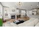 Inviting living room with a stylish fireplace, hardwood floors, and an open layout to the kitchen at 1744 Habershal Nw Rd, Atlanta, GA 30318