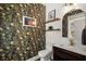 Stylish powder room with floral wallpaper, wood shelves, decorative mirror, modern vanity, and shiplap accents at 1744 Habershal Nw Rd, Atlanta, GA 30318