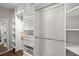 Spacious walk-in closet with custom shelving and ample storage for clothes, shoes, and accessories at 1744 Habershal Nw Rd, Atlanta, GA 30318