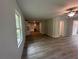 Spacious living area with hard surface floors, ceiling fan, and easy access to the kitchen at 45 Emerald Ln, Covington, GA 30014