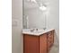 Bathroom with a double sink vanity, ample cabinet space, and a large mirror at 5661 Radford Loop, Fairburn, GA 30213