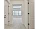 Hallway with carpeted floors and white trim at 5661 Radford Loop, Fairburn, GA 30213