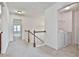 Hallway that features the laundry area and natural light at 5661 Radford Loop, Fairburn, GA 30213